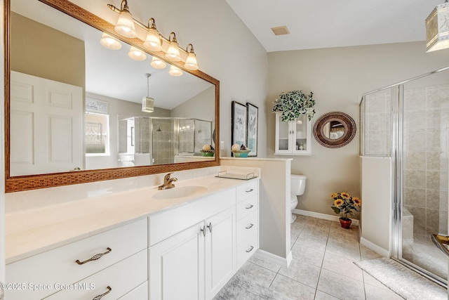 bathroom with walk in shower, tile patterned floors, vanity, and toilet