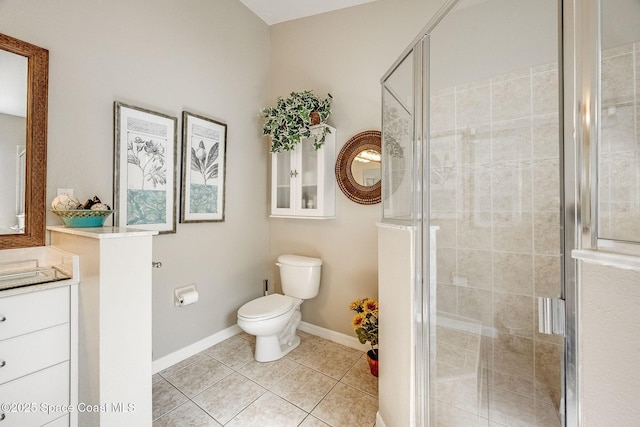 bathroom featuring tile patterned flooring, vanity, an enclosed shower, and toilet