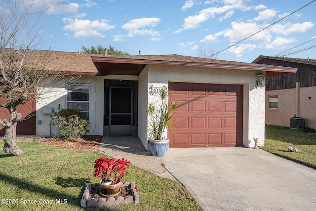 ranch-style house with a garage and a front lawn