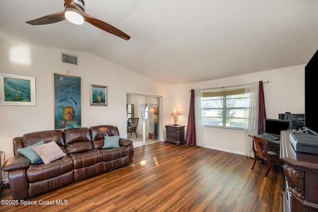 living room featuring ceiling fan, dark hardwood / wood-style flooring, vaulted ceiling, and a textured ceiling