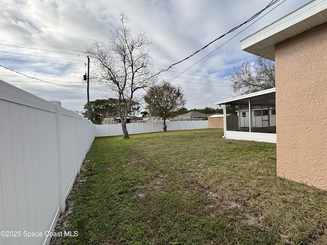 view of yard featuring a sunroom