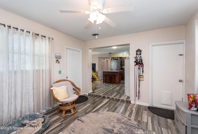 entrance foyer featuring dark wood-type flooring and ceiling fan