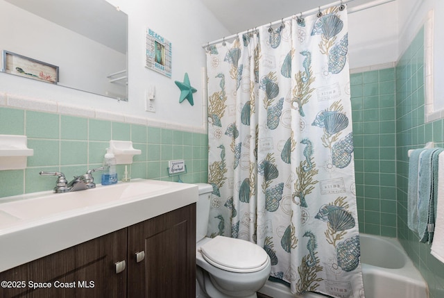 full bathroom featuring vanity, toilet, tile walls, and shower / bath combo