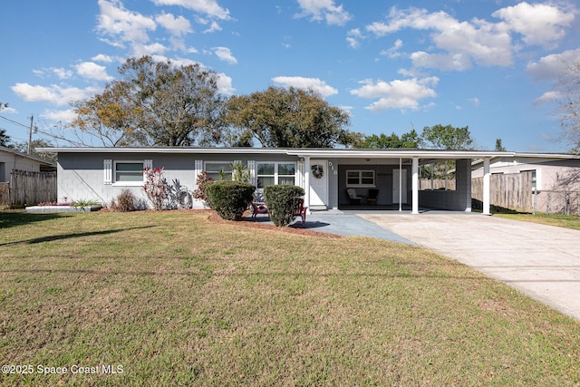 ranch-style house with a carport and a front lawn