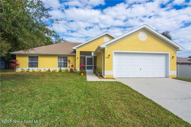 ranch-style home with a garage and a front lawn