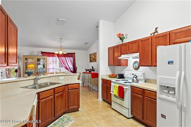 kitchen featuring sink, an inviting chandelier, decorative light fixtures, vaulted ceiling, and white appliances