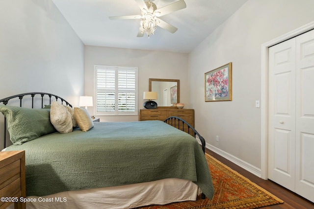 1459 Southpointe Ct, Melbourne, FL 32940 - bedroom featuring dark wood finished floors, baseboards, a closet, and ceiling fan
