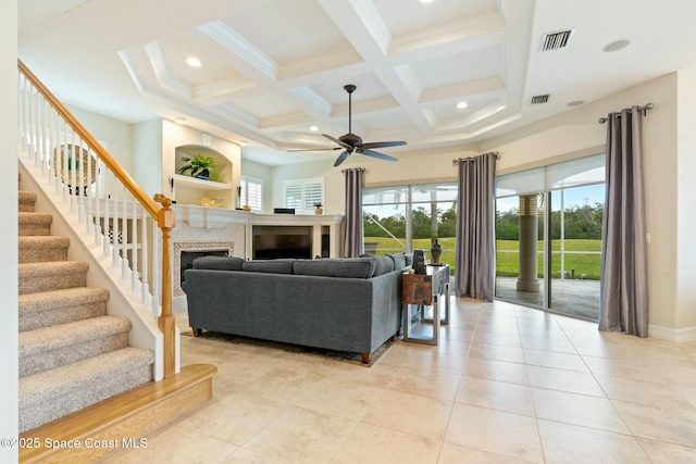1459 Southpointe Ct, Melbourne, FL 32940 - living area with coffered ceiling, beamed ceiling, visible vents, a ceiling fan, and a fireplace