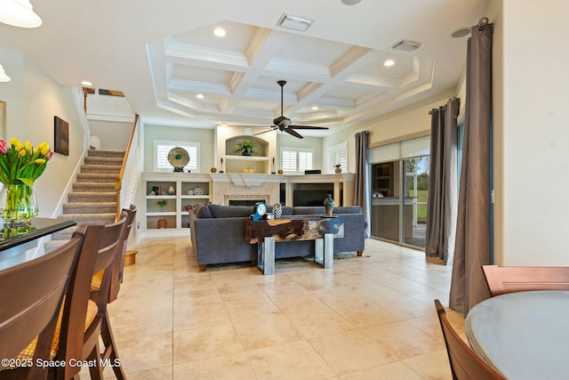 1459 Southpointe Ct, Melbourne, FL 32940 - living area with a fireplace, coffered ceiling, ceiling fan, and visible vents