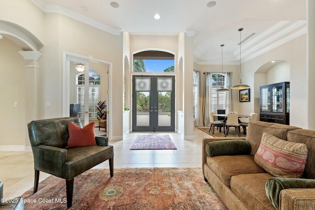 1459 Southpointe Ct, Melbourne, FL 32940 - entryway with french doors, light tile patterned floors, ornamental molding, baseboards, and arched walkways