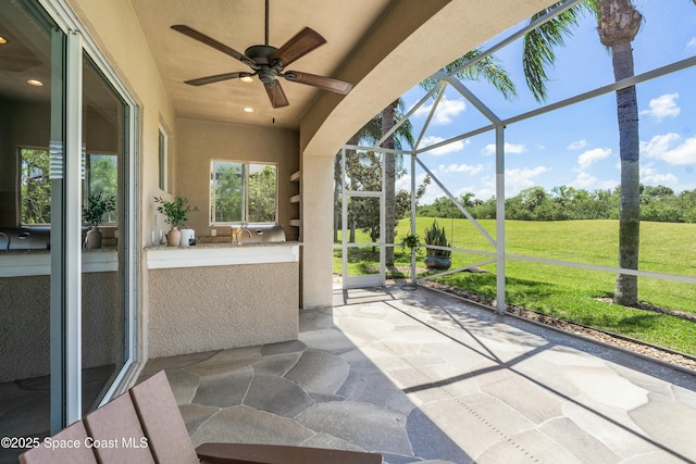 1459 Southpointe Ct, Melbourne, FL 32940 - sunroom with an outdoor kitchen and a ceiling fan