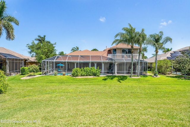 1459 Southpointe Ct, Melbourne, FL 32940 - rear view of property featuring stucco siding, glass enclosure, and a lawn