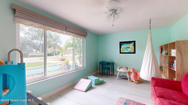 game room with ceiling fan