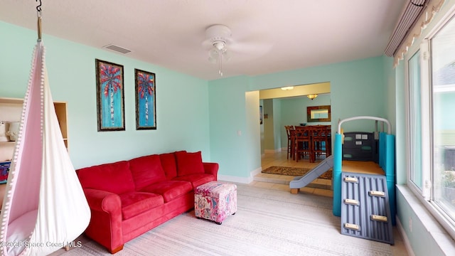 living room with ceiling fan