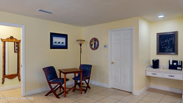 sitting room with light tile patterned floors