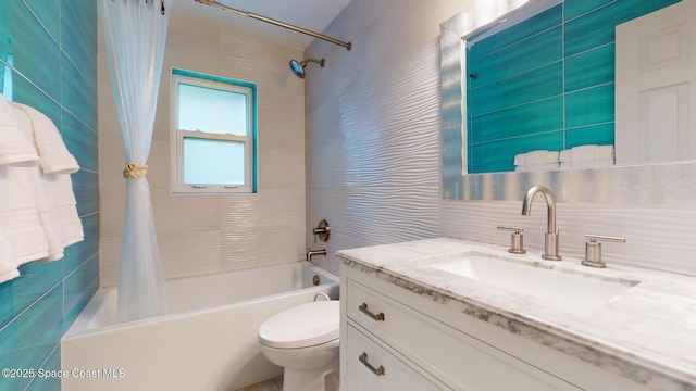 full bathroom featuring toilet, tile walls, vanity, shower / bath combo with shower curtain, and decorative backsplash