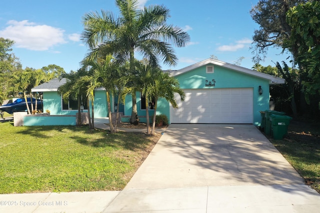 view of front of house with a garage and a front lawn