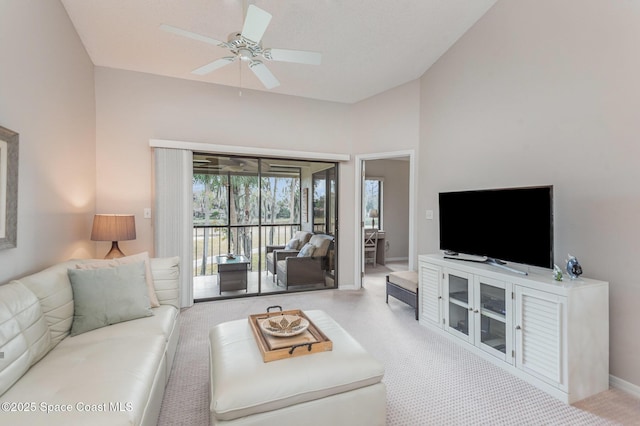 living room with lofted ceiling and ceiling fan