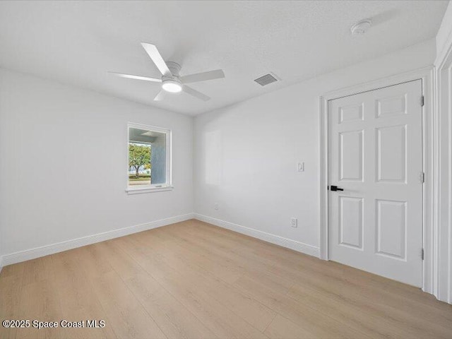 unfurnished room featuring ceiling fan and light hardwood / wood-style floors