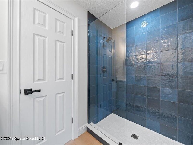 bathroom with a tile shower