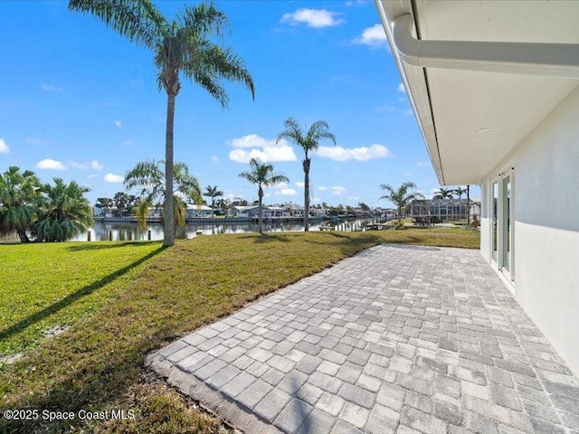 view of patio featuring a water view