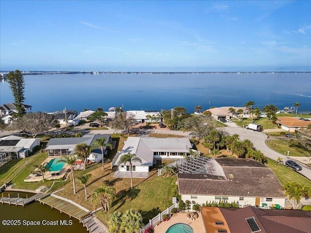 birds eye view of property featuring a water view