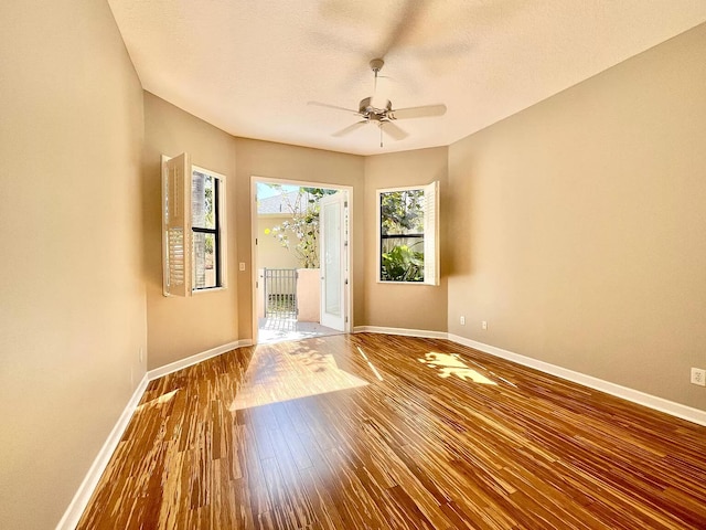 interior space with ceiling fan and hardwood / wood-style floors