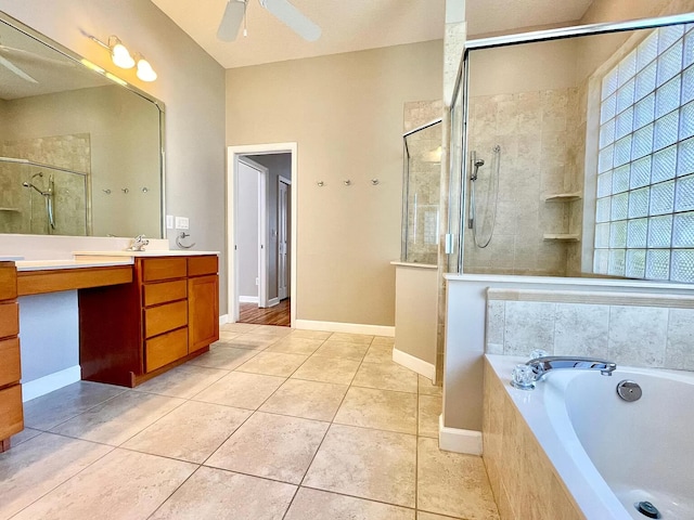 bathroom featuring vanity, tile patterned flooring, shower with separate bathtub, and ceiling fan