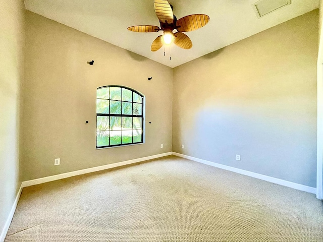 spare room with ceiling fan and carpet flooring