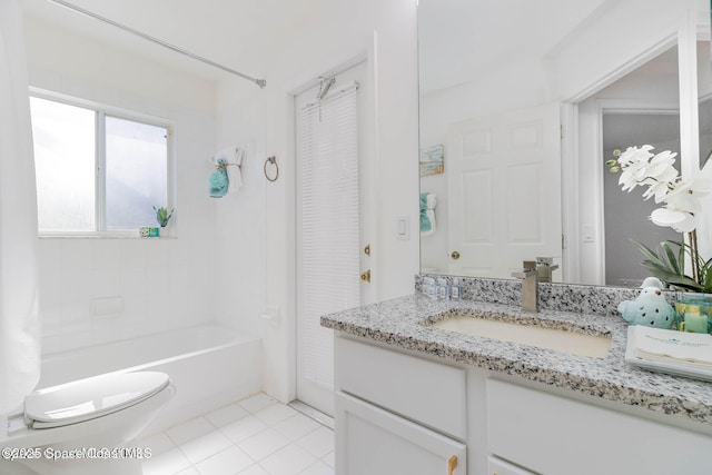 full bathroom with vanity, toilet, tiled shower / bath combo, and tile patterned flooring