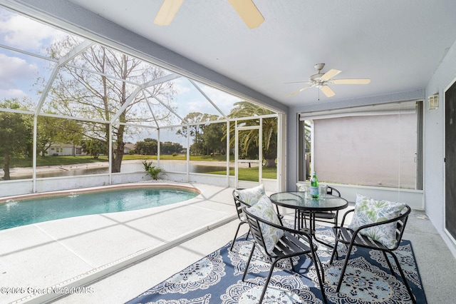 view of pool featuring a lanai, a patio area, and ceiling fan