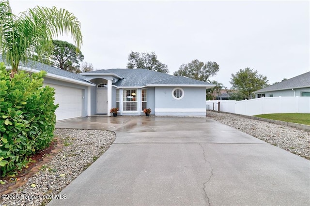 ranch-style house featuring a garage