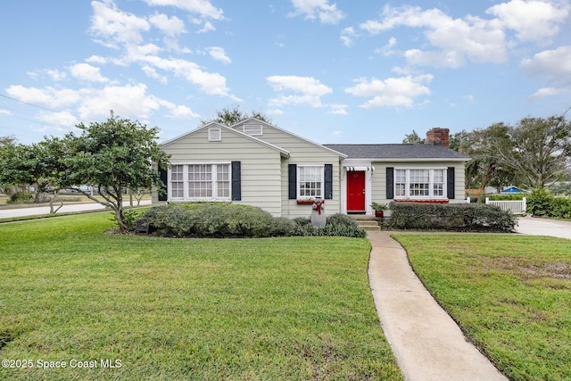 single story home featuring a front lawn