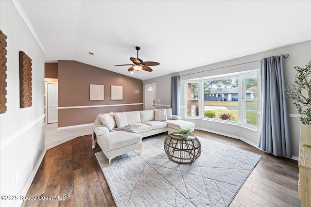 living room with hardwood / wood-style flooring, lofted ceiling, and ceiling fan