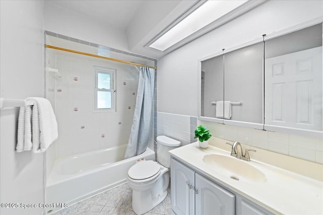 full bathroom featuring tile walls, vanity, shower / tub combo, toilet, and tile patterned floors