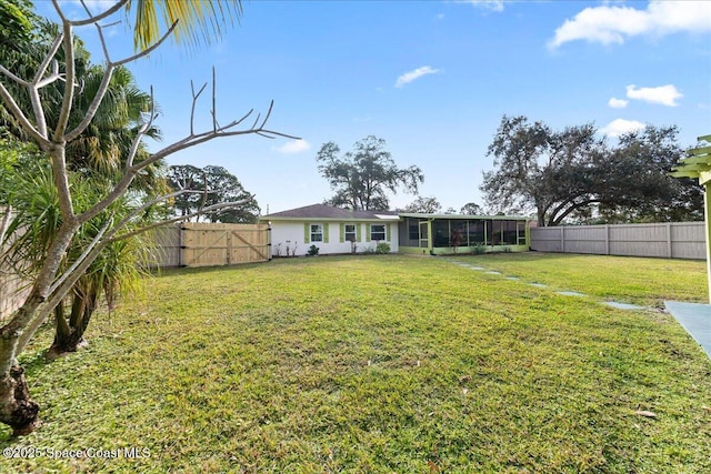 view of yard with a sunroom