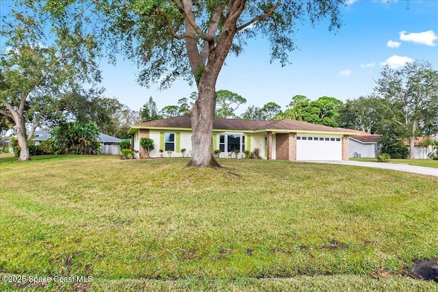 ranch-style house featuring a garage and a front yard