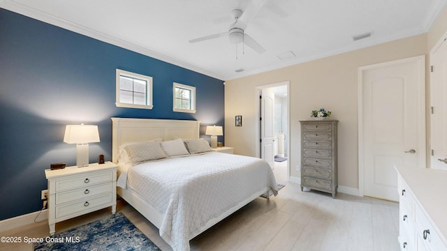 bedroom with light wood-type flooring, visible vents, ornamental molding, baseboards, and ceiling fan