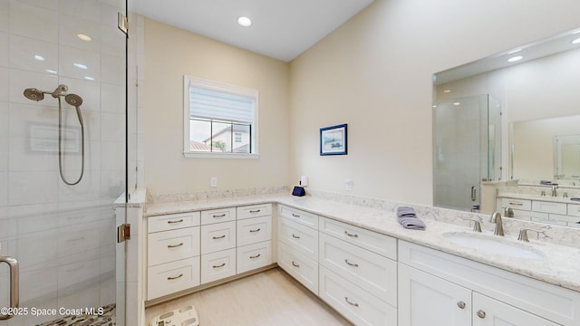 full bath featuring vanity, recessed lighting, wood finished floors, and a stall shower