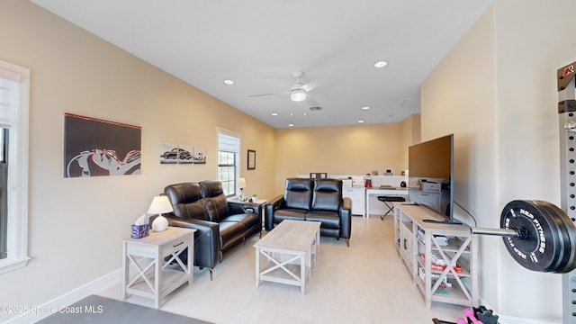 living area featuring recessed lighting, baseboards, and a ceiling fan