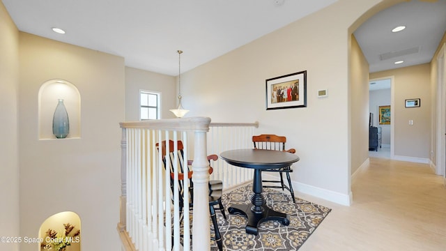 corridor with recessed lighting and baseboards