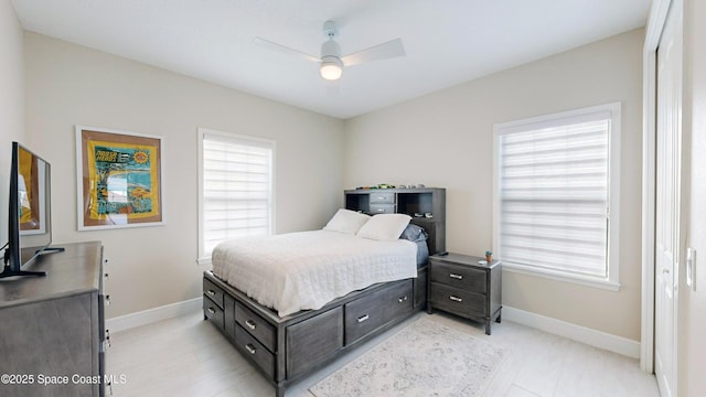 bedroom featuring a ceiling fan and baseboards