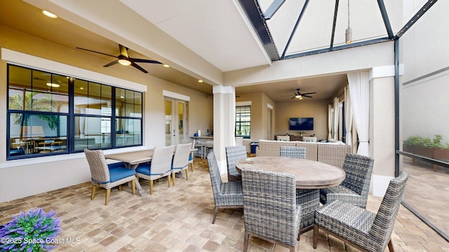 view of patio with an outdoor living space, outdoor dining area, and ceiling fan