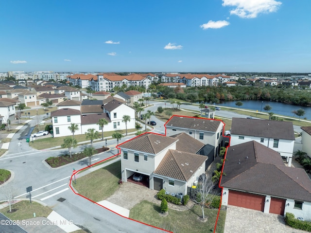 birds eye view of property featuring a residential view and a water view