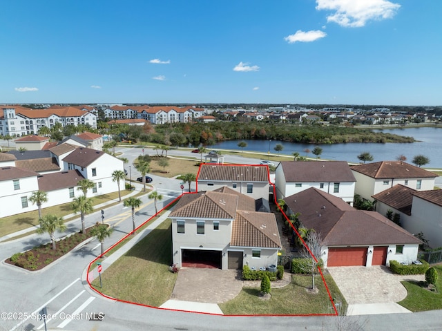 bird's eye view featuring a residential view and a water view