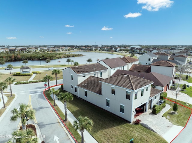 birds eye view of property featuring a residential view and a water view