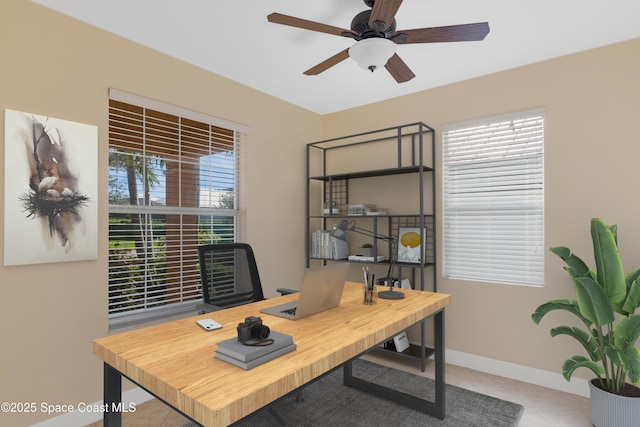 office space featuring light tile patterned floors and ceiling fan