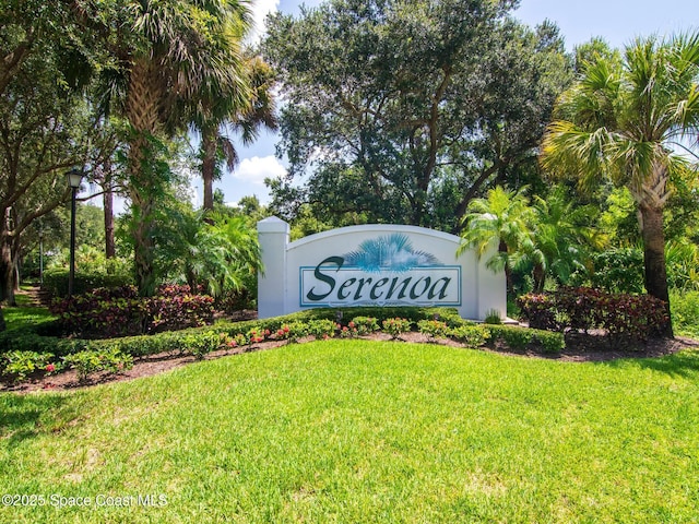 community / neighborhood sign featuring a yard