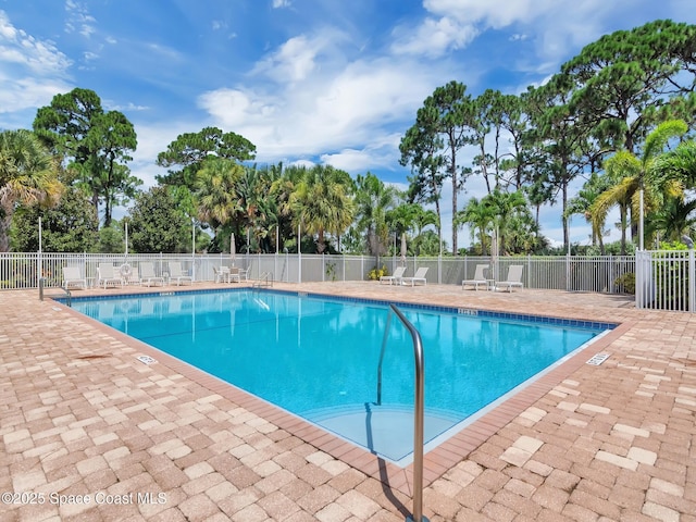 view of swimming pool featuring a patio