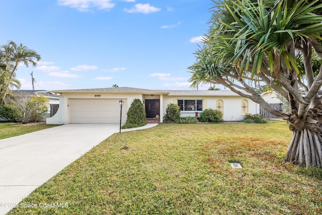 single story home featuring a garage and a front lawn